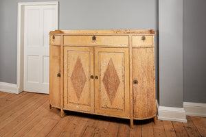 an antique wooden sideboard with rounded sides