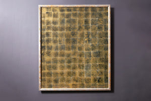 A silver eglomise panel with gilt frame