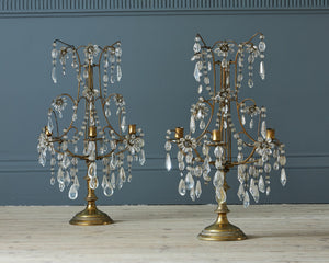 a pair of metal table lights with clear glass droplets