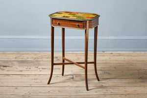an antique side table with paitned checkerboard top