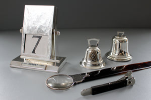 antique silver desk calendar, magnifying glass, paper knife and inkwell